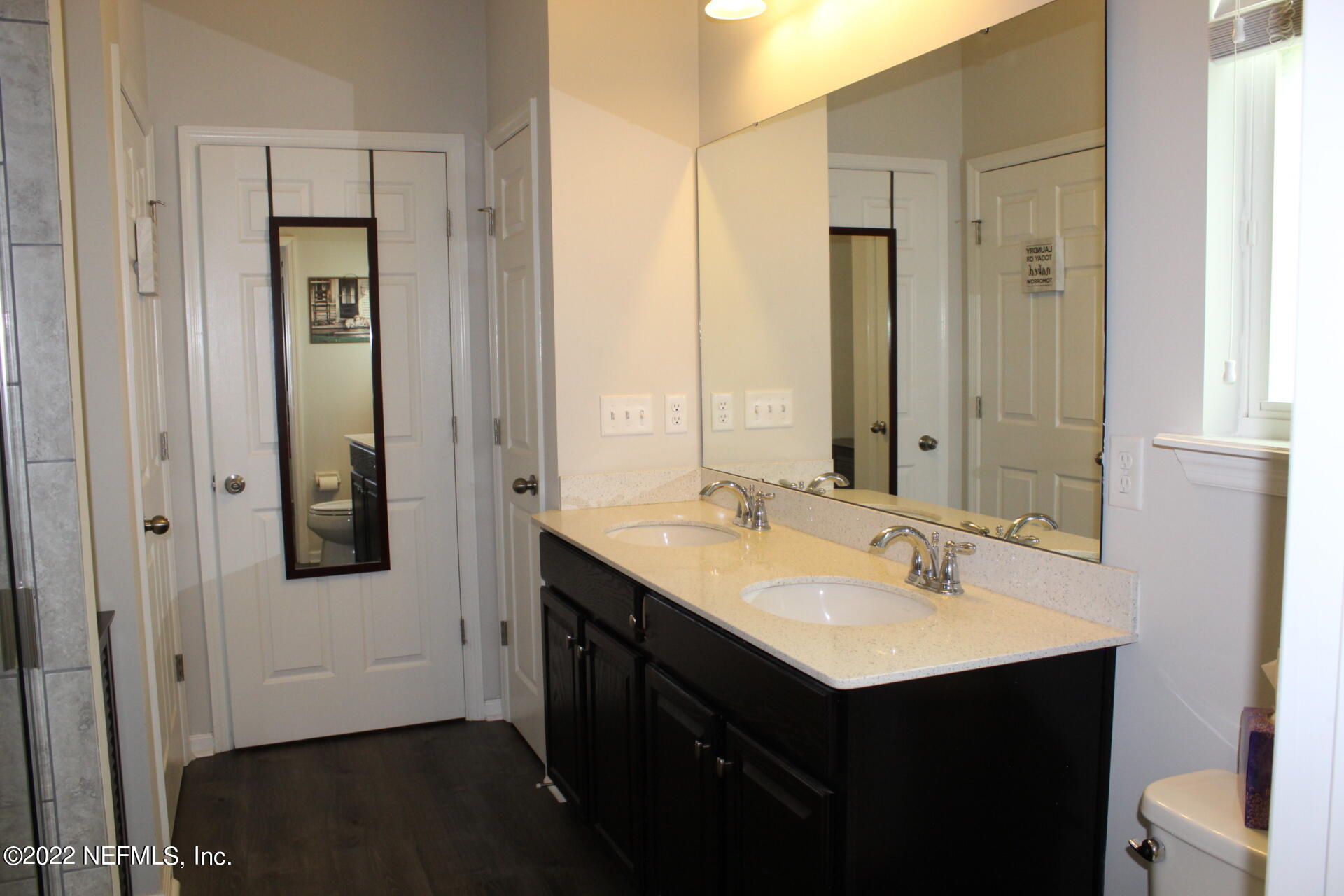552 Richmond Drive St. Johns, FL 32259 - Photo 29 of 50 a bathroom with a sink vanity and mirror