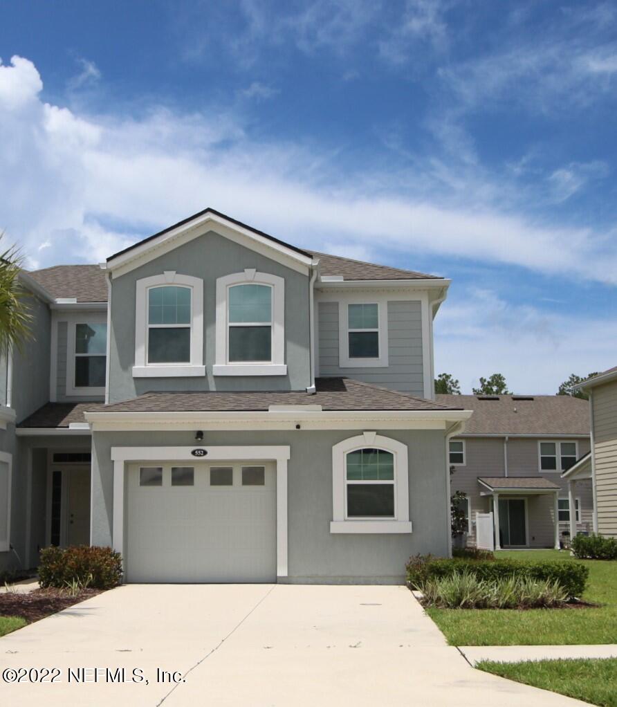 552 Richmond Drive St. Johns, FL 32259 - Photo 3 of 50 a front view of a house with a garden