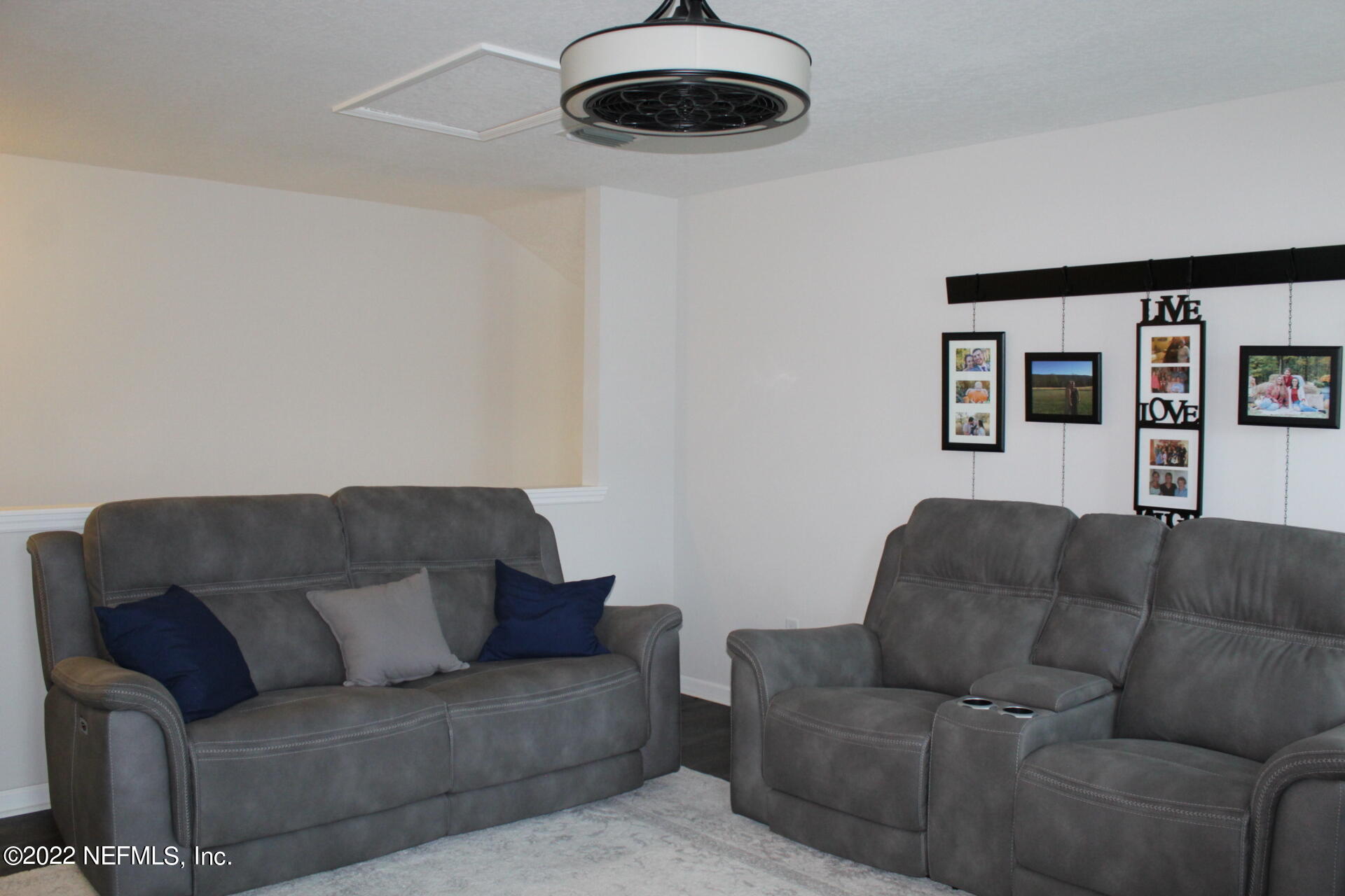 552 Richmond Drive St. Johns, FL 32259 - Photo 32 of 50 a living room with furniture and a ceiling fan