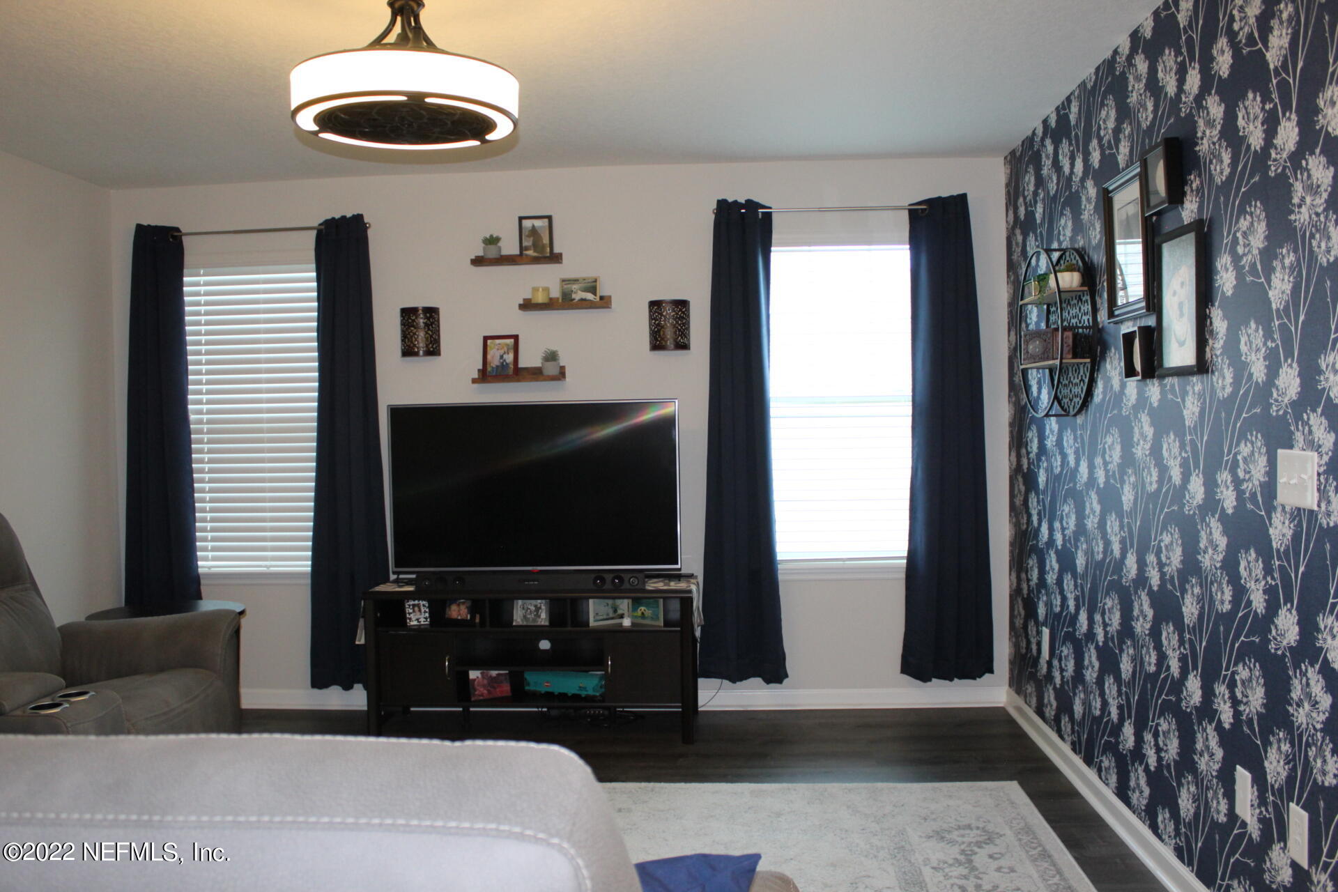 552 Richmond Drive St. Johns, FL 32259 - Photo 35 of 50 a living room with furniture and a flat screen tv