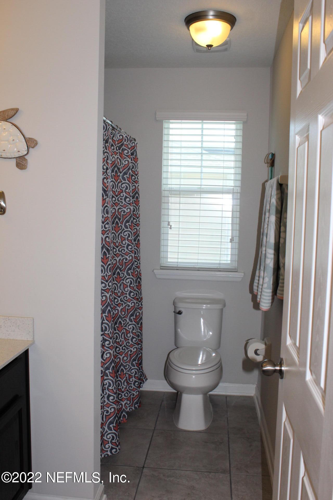 552 Richmond Drive St. Johns, FL 32259 - Photo 37 of 50 a bathroom with a sink toilet and shower