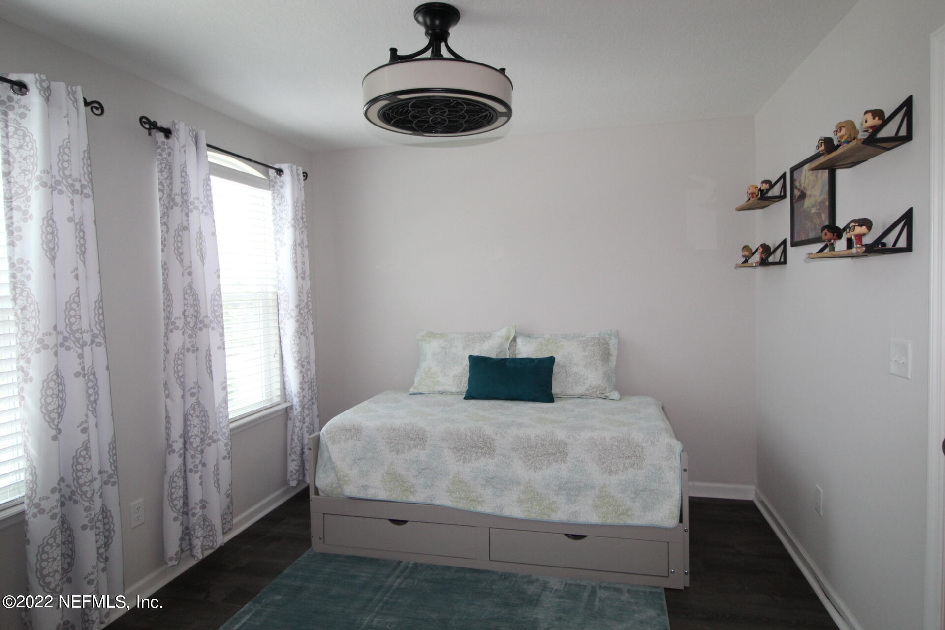 552 Richmond Drive St. Johns, FL 32259 - Photo 42 of 50 a bedroom with a bed and a window