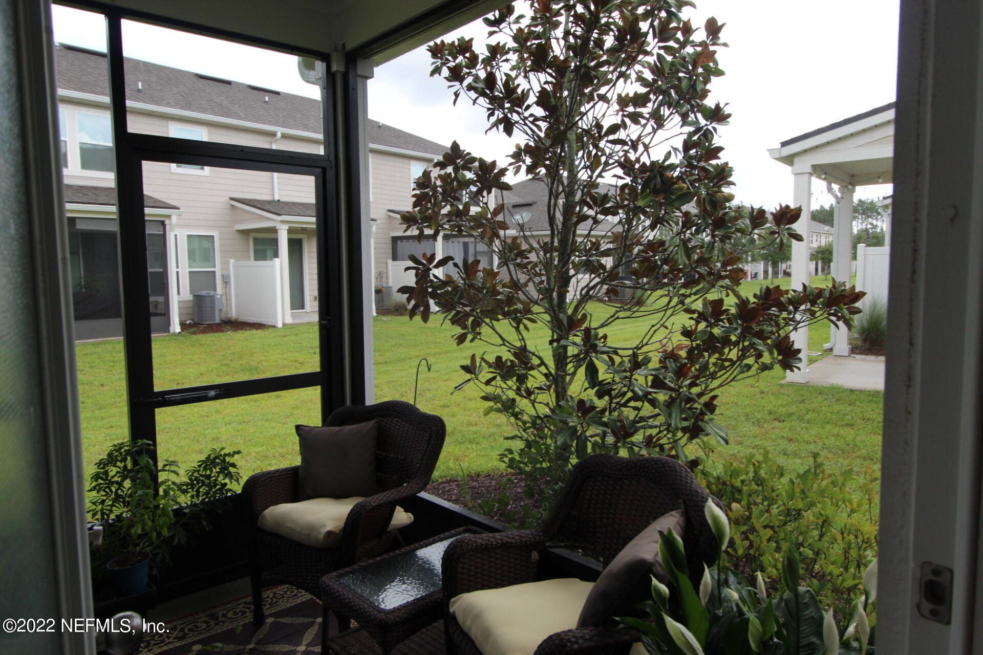 552 Richmond Drive St. Johns, FL 32259 - Photo 9 of 50 a view of a chair and table in backyard