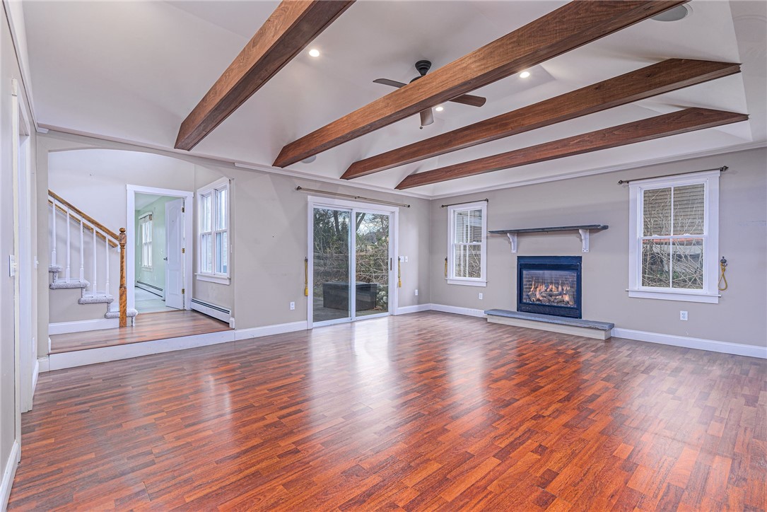 61 Howland Avenue Jamestown, RI 02835 - Photo 20 of 31 has sliders to rear patio, and gas fireplace