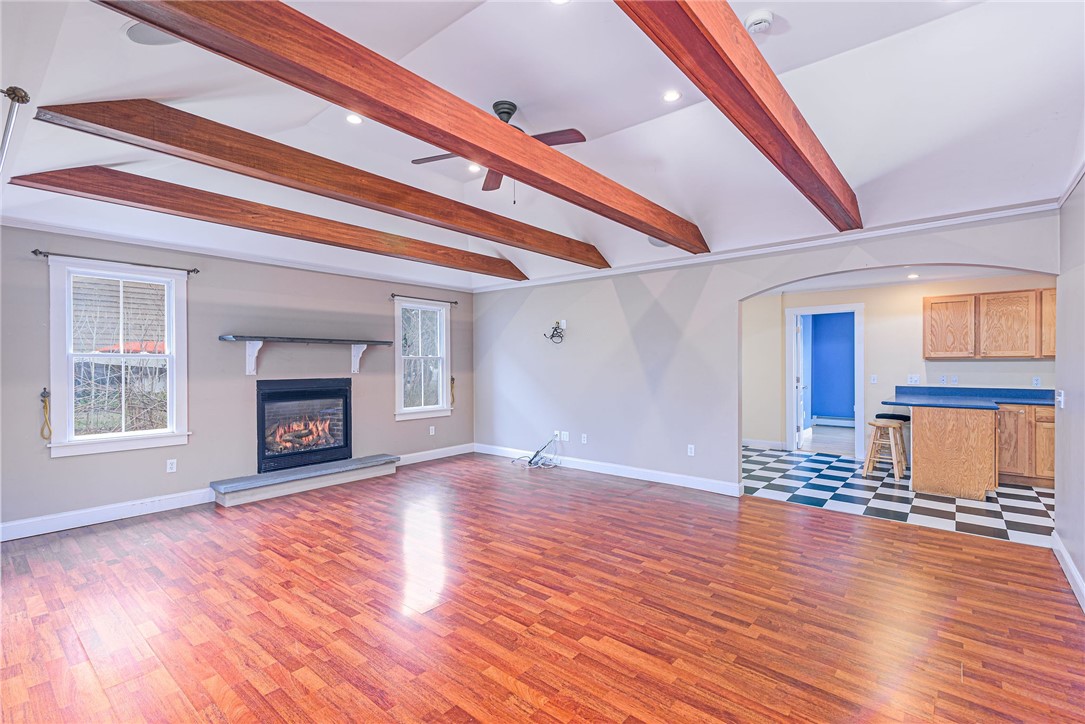 61 Howland Avenue Jamestown, RI 02835 - Photo 21 of 31 Vaulted living room with gas fireplace