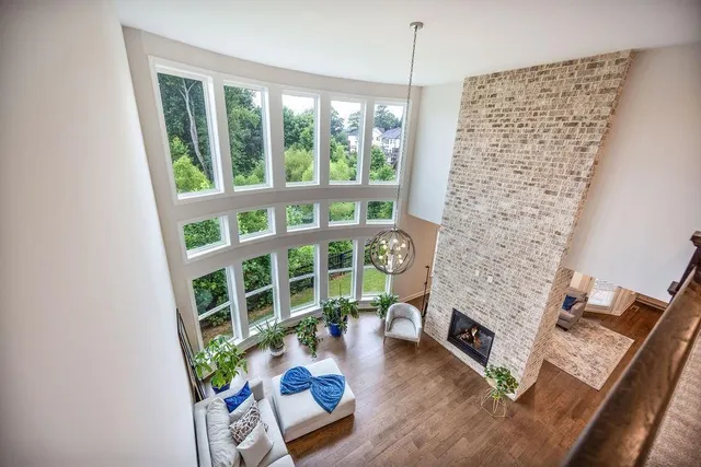 a living room with furniture and a floor to ceiling window