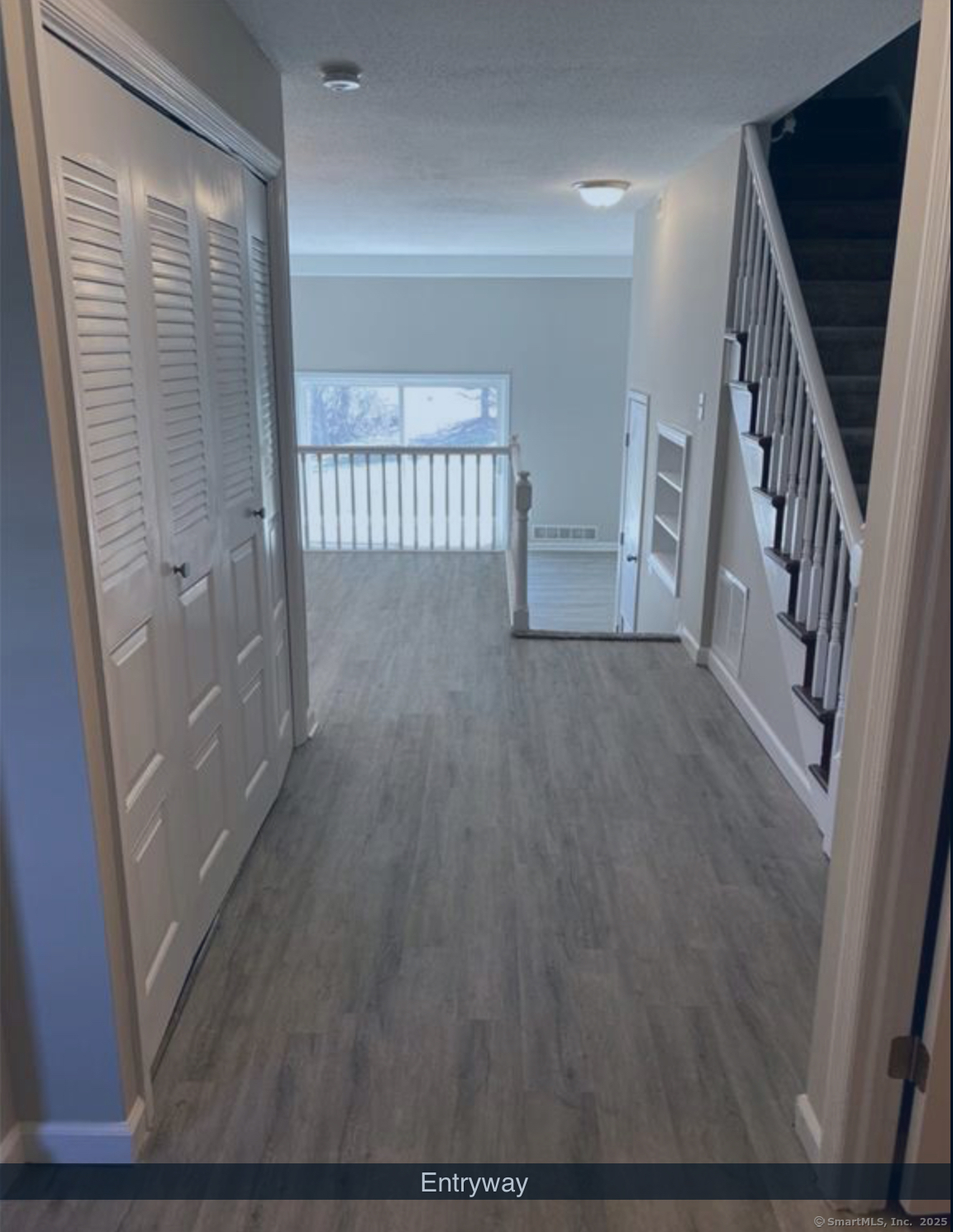 99 Brittany Farms Road, Unit F New Britain, CT 06053 - Photo 2 of 31 a view of a hallway with wooden floor