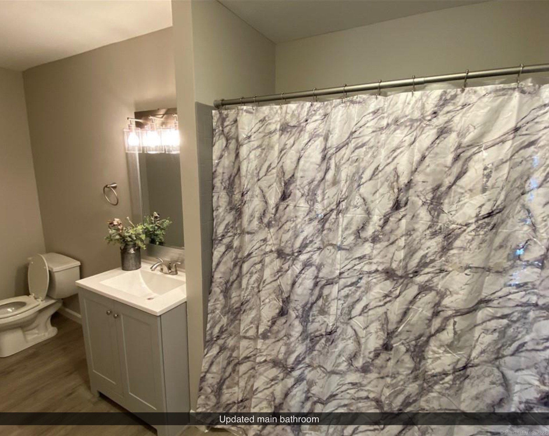 99 Brittany Farms Road, Unit F New Britain, CT 06053 - Photo 21 of 31 a bathroom with a sink and mirror with toilet