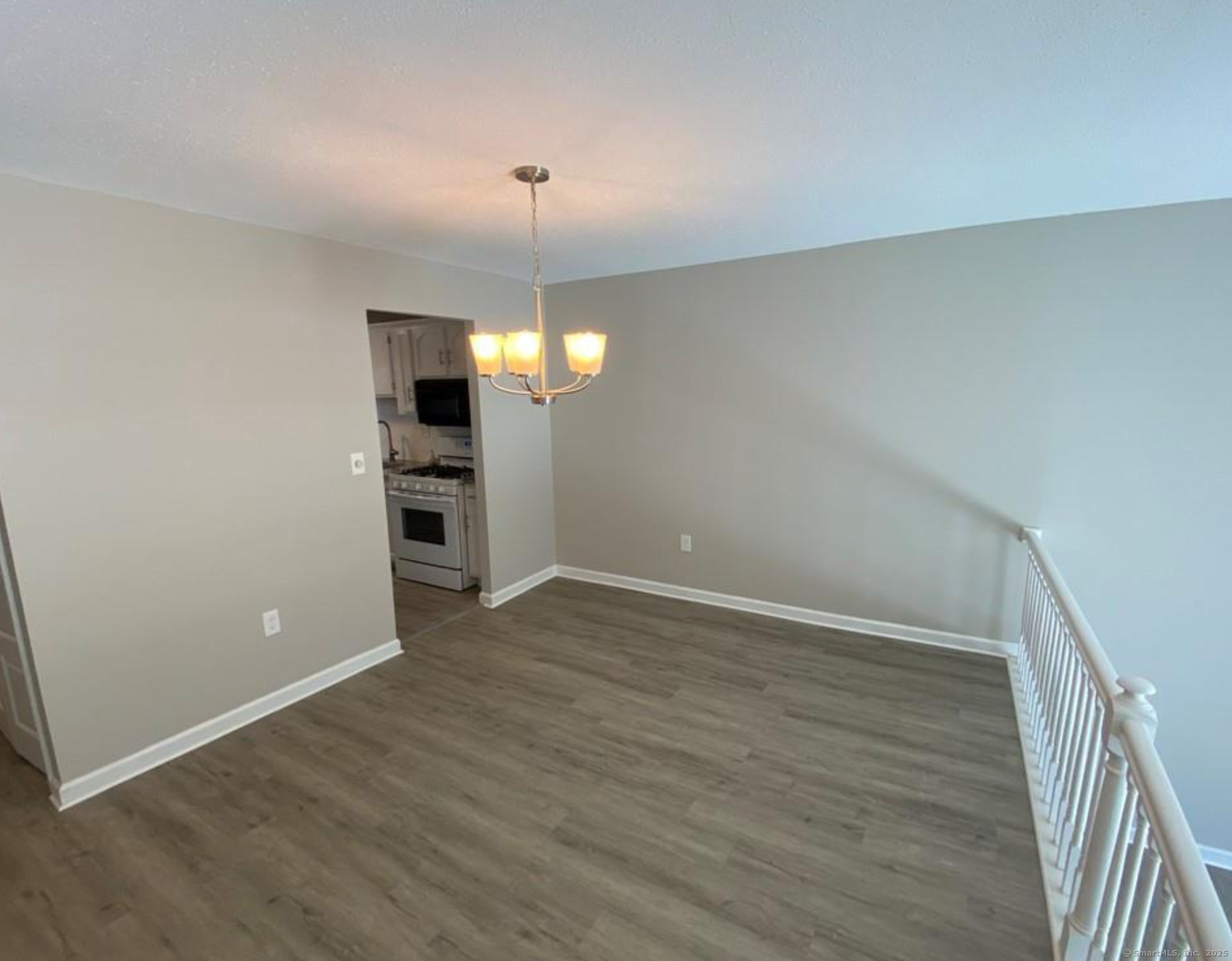 99 Brittany Farms Road, Unit F New Britain, CT 06053 - Photo 8 of 31 wooden floor in an empty room with a window