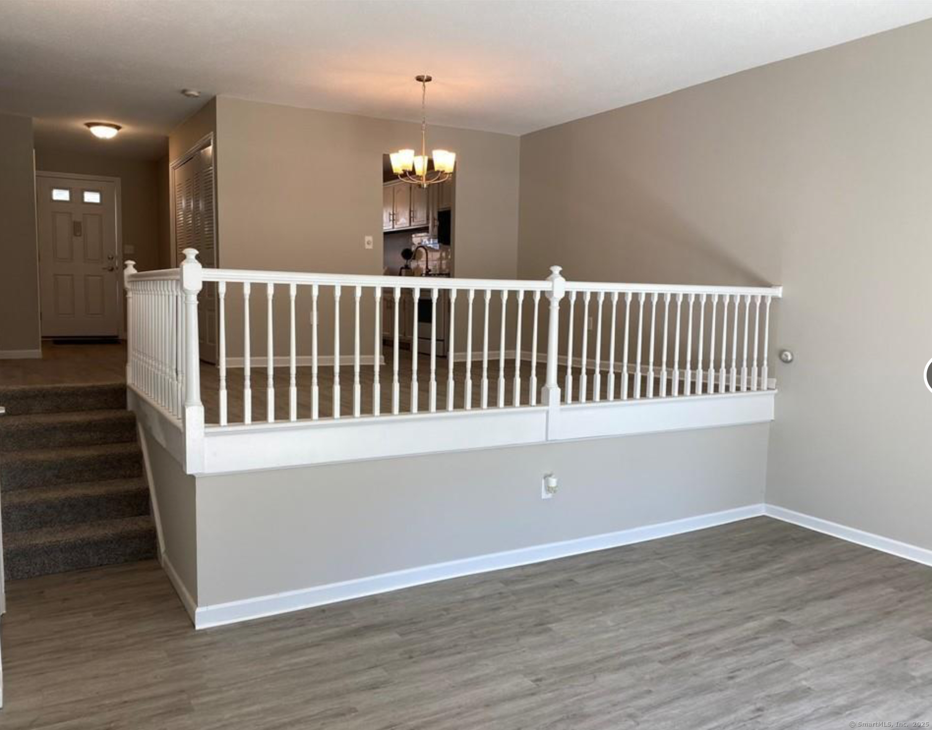 99 Brittany Farms Road, Unit F New Britain, CT 06053 - Photo 10 of 31 an empty room with wooden floor and windows