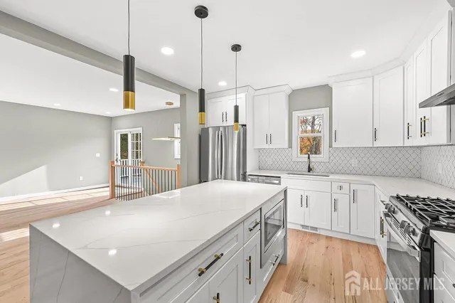 a kitchen with sink cabinets and window