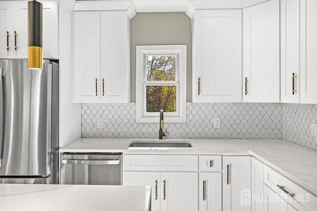 a view of a kitchen with an empty room