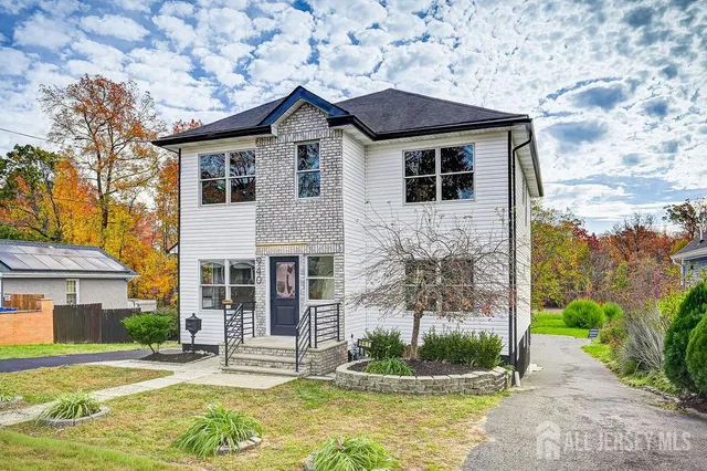 a view of a brick house with many windows