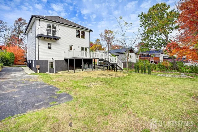 a view of a white building with a large windows