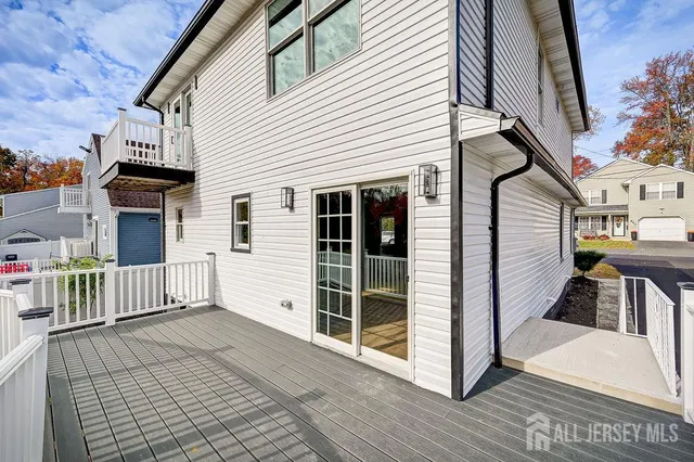 a view of a house with wooden deck