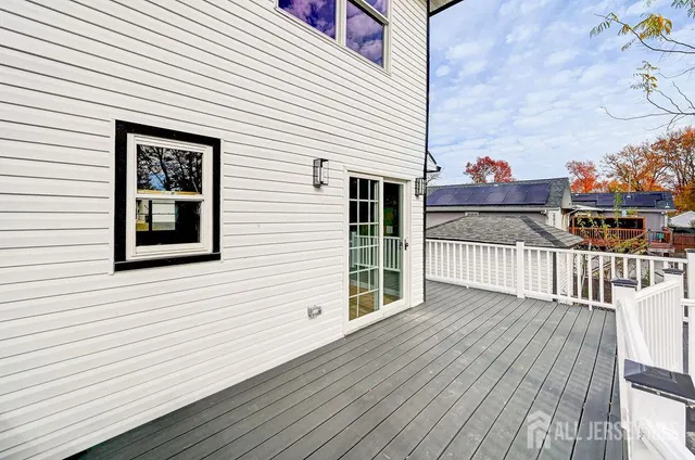 a view of a balcony with wooden fence