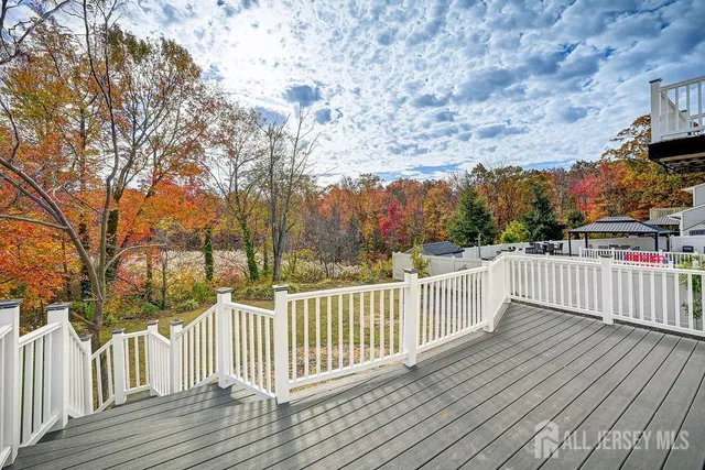 a view of deck with wooden floor and fence