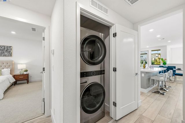 a view of a hallway with washer and dryer