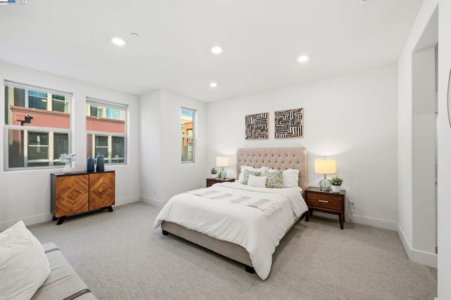 a bedroom with a bed and dresser