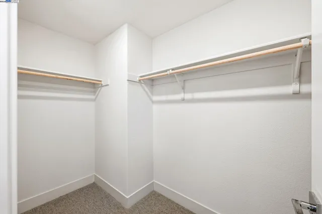 a bathroom with a double vanity sink toilet and shower