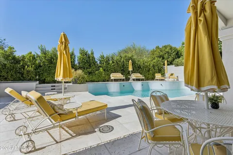 a view of a patio with swimming pool