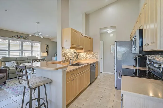 a kitchen with a stove microwave and refrigerator