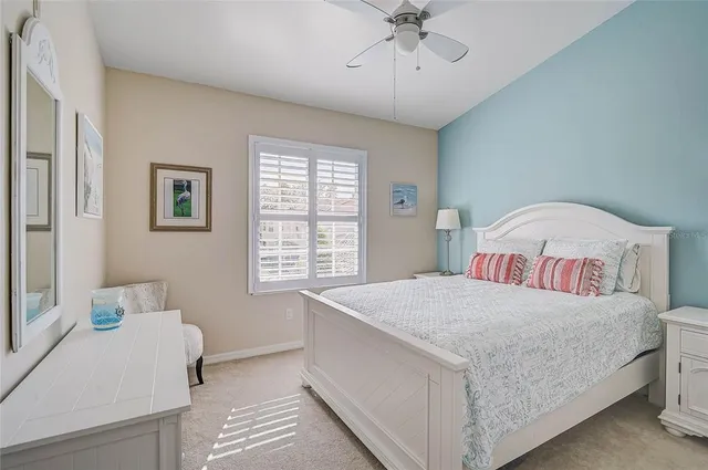 a bedroom with a bed and a lamp