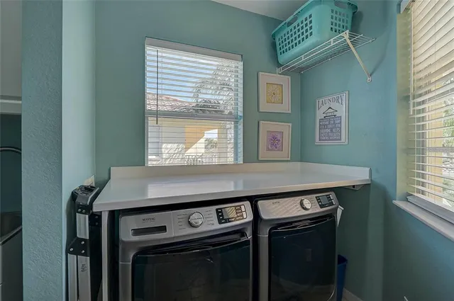 a balcony with furniture and a potted plant