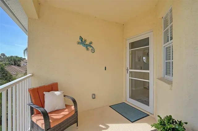 a view of a chairs and table in the balcony