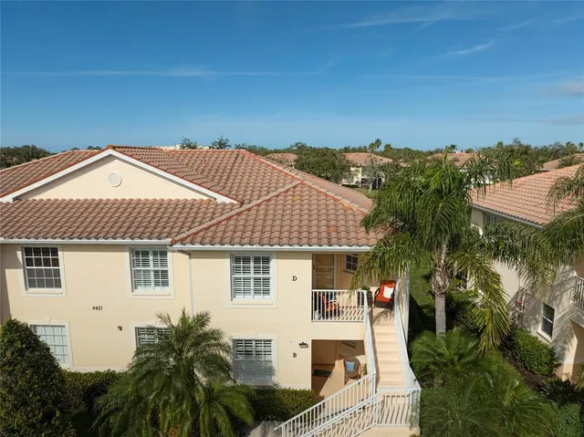 a aerial view of a house with a yard