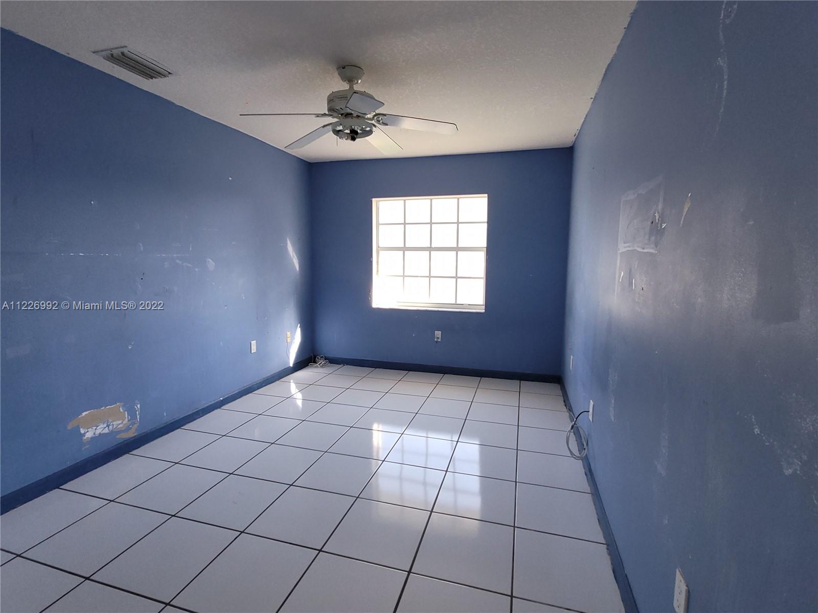 14830 Southwest 149th Street Miami, FL 33196 - Photo 12 of 25 a view of an empty room and window