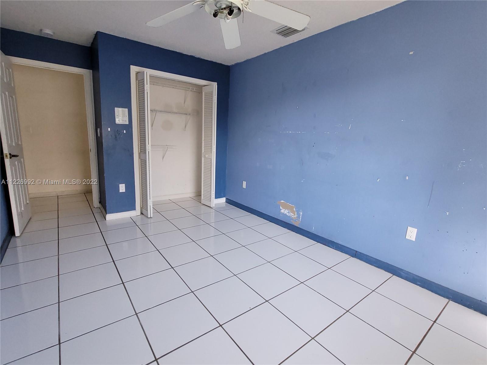 14830 Southwest 149th Street Miami, FL 33196 - Photo 13 of 25 a view of a livingroom with an empty space and a chandelier