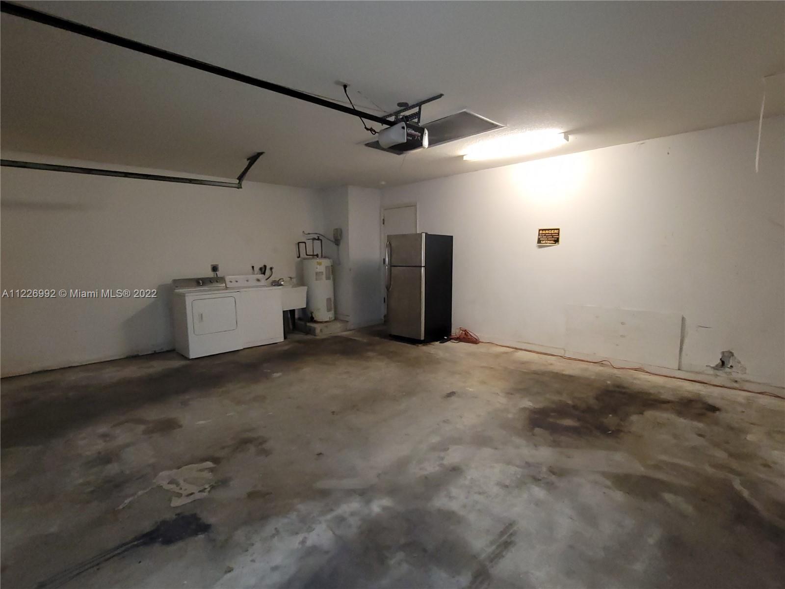14830 Southwest 149th Street Miami, FL 33196 - Photo 15 of 25 a view of a garage