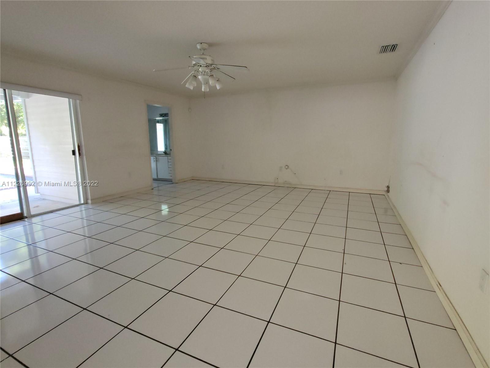 14830 Southwest 149th Street Miami, FL 33196 - Photo 16 of 25 a view of an empty room and window