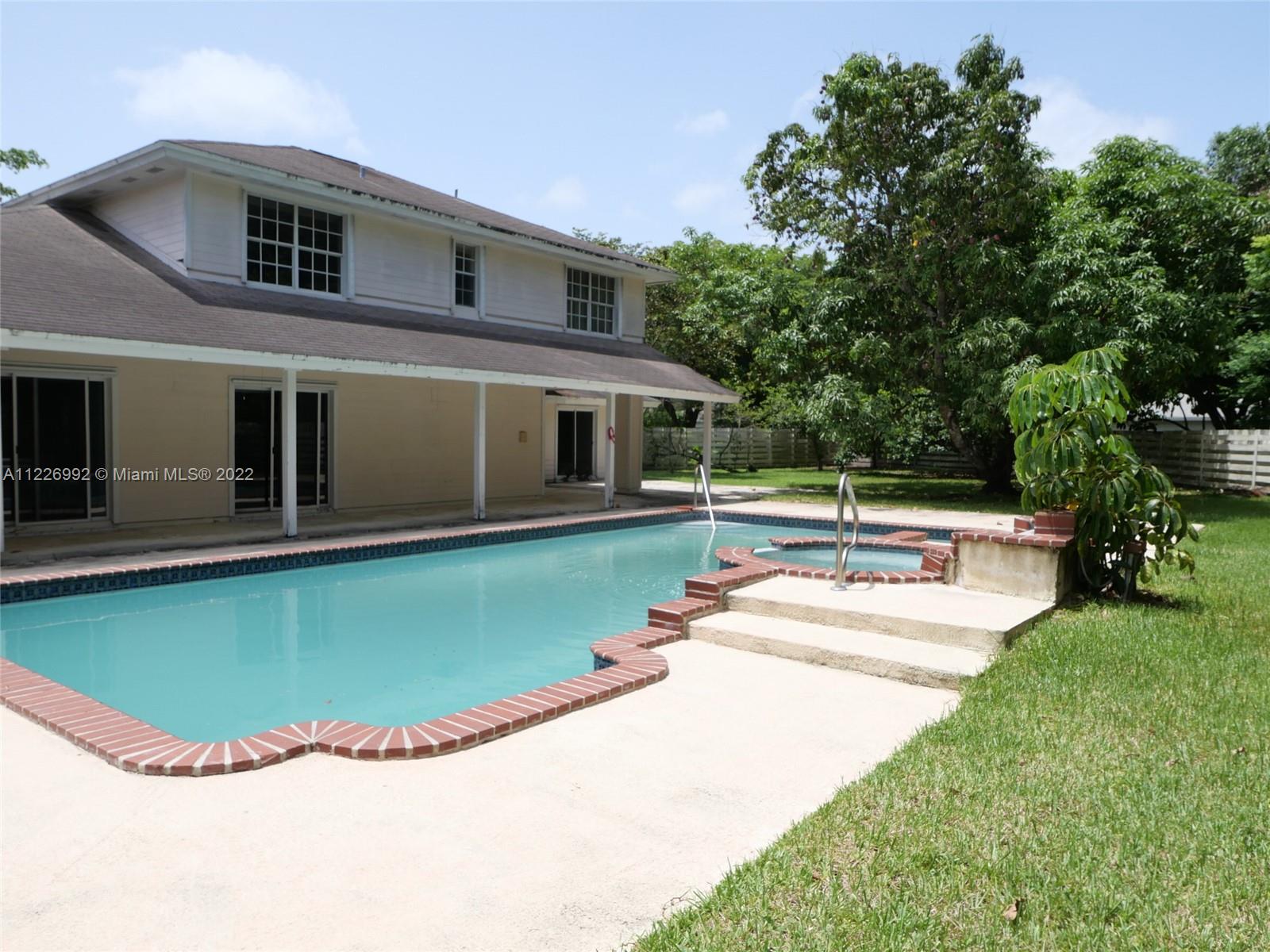 14830 Southwest 149th Street Miami, FL 33196 - Photo 2 of 25 a view of a house with swimming pool