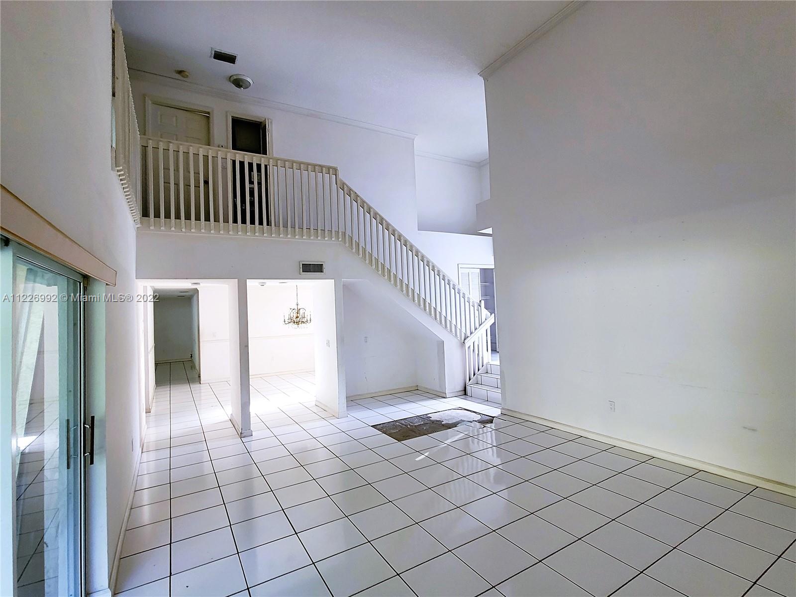 14830 Southwest 149th Street Miami, FL 33196 - Photo 4 of 25 a view of an entryway with a floor
