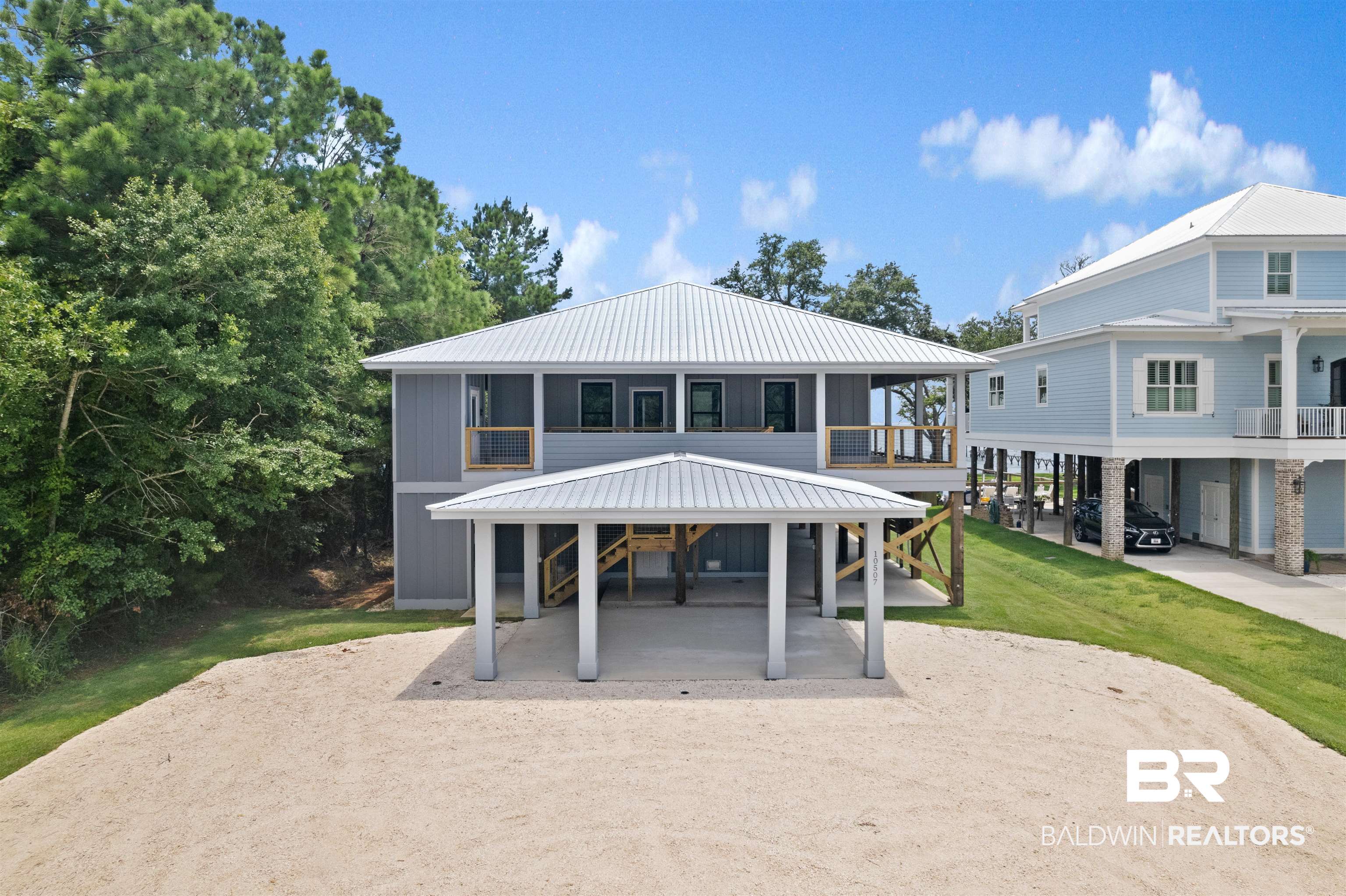 10507 County Road 1 Fairhope, AL 36532 - Photo 39 of 59 Back of house with a carport, a yard, and a balcony