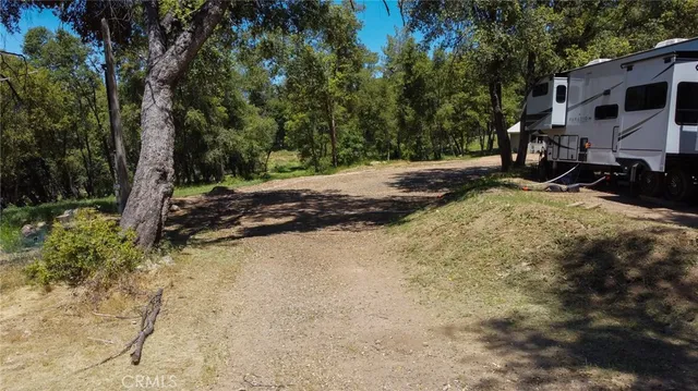 a backyard of a house with barbeque oven