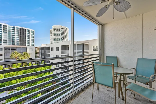 a view of a balcony with chairs