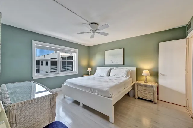 a bedroom with a bed couch and window