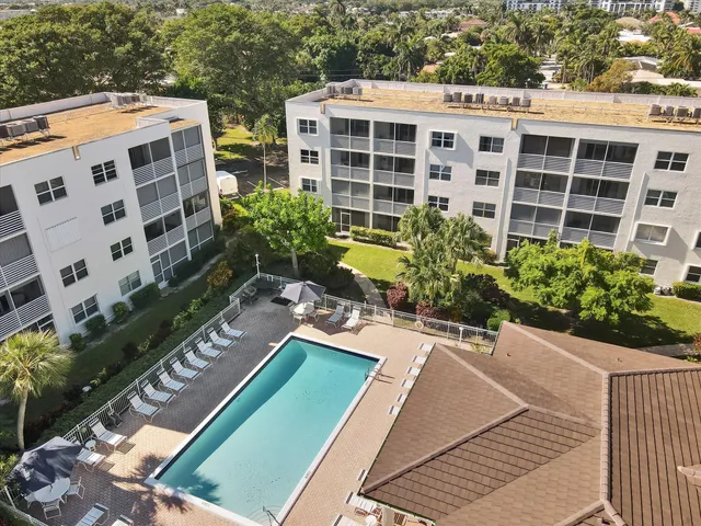 a view of a patio with table and chairs and potted plants