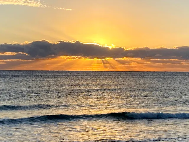 a view of ocean with a terrace