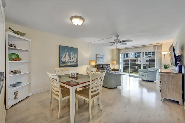 a living room with furniture and floor to ceiling window