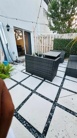 a view of a balcony with furniture