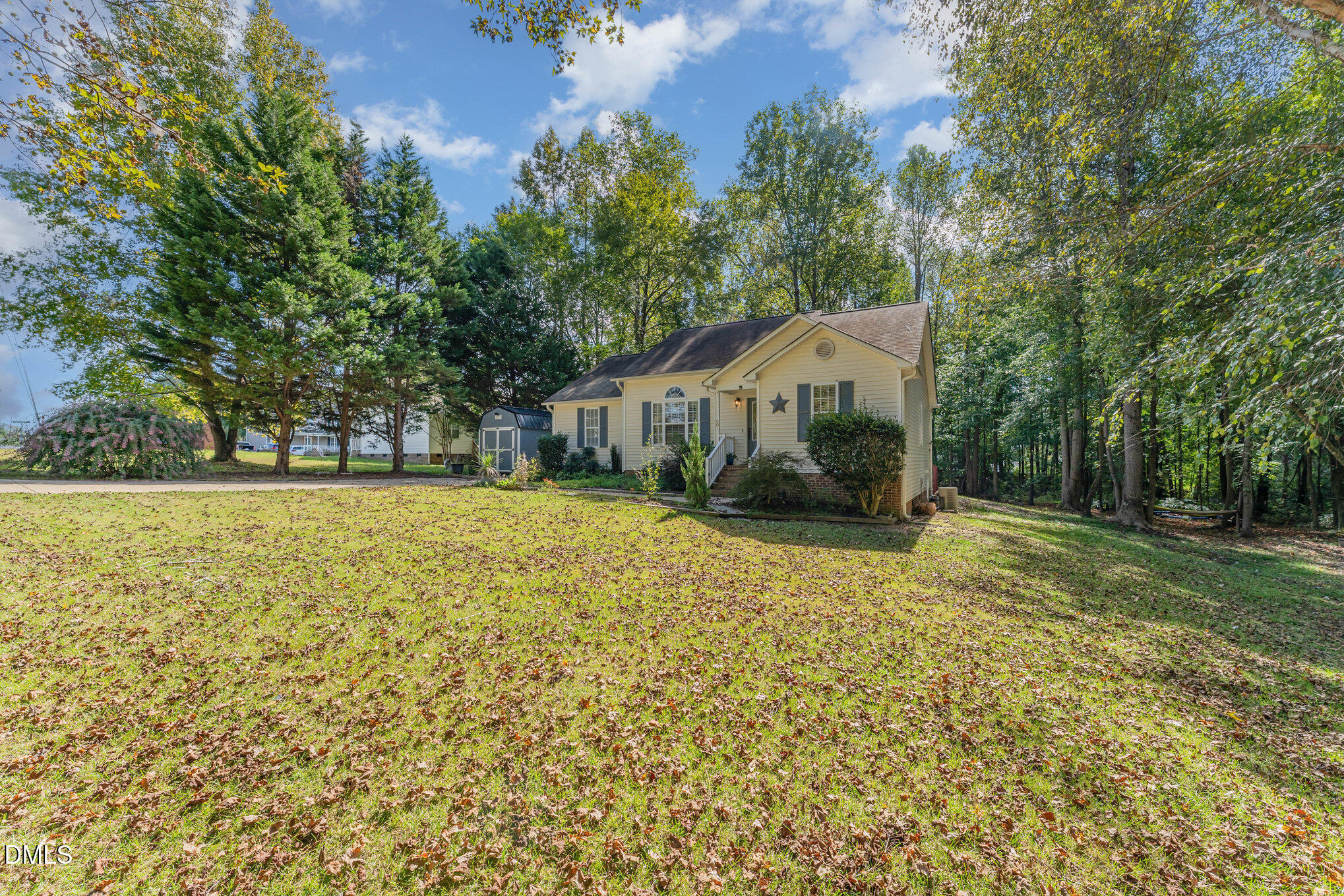 687 West Watson Road Benson, NC 27504 - Photo 20 of 25 a house with trees in front of it