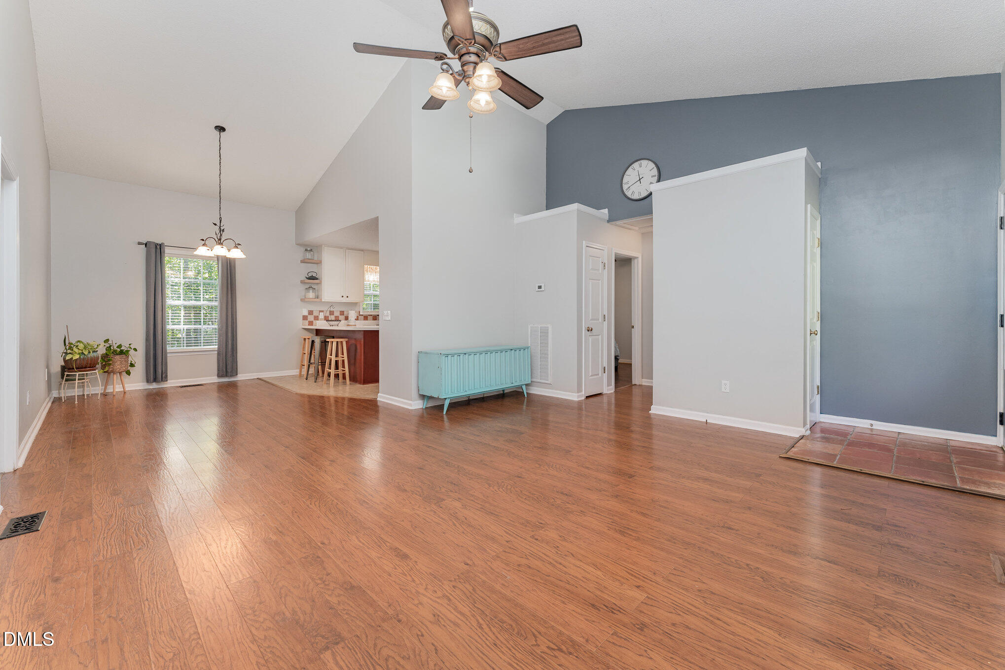687 West Watson Road Benson, NC 27504 - Photo 4 of 25 a view of empty room with wooden floor and ceiling fan