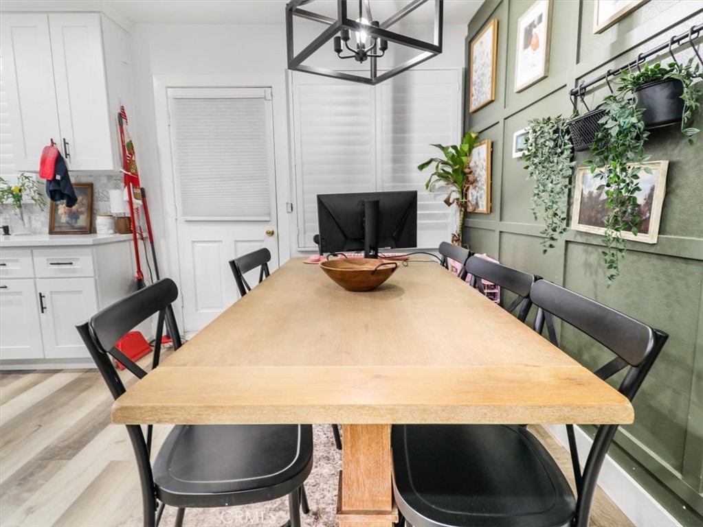 6502 Dos Rios Road Downey, CA 90240 - Photo 13 of 21 a room with furniture a flat screen tv and a table