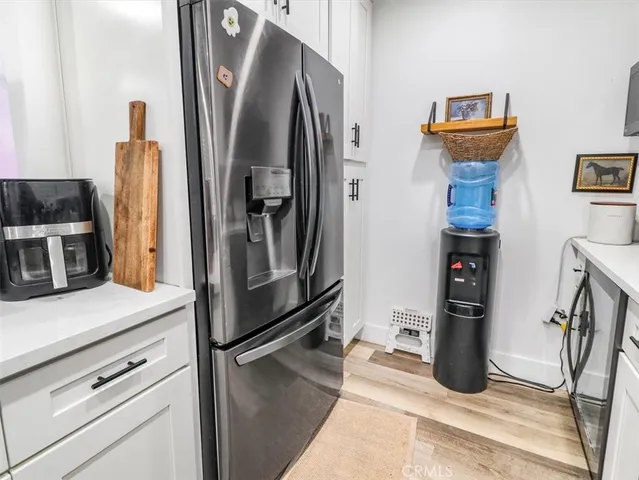 a kitchen with stainless steel appliances a refrigerator and a stove