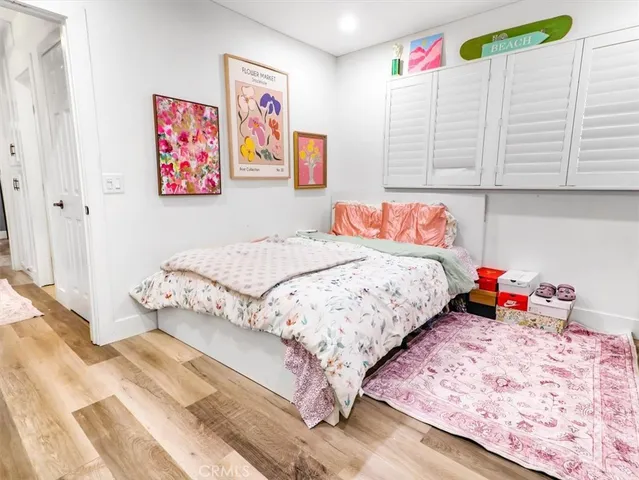 a bedroom with a bed and a baby crib