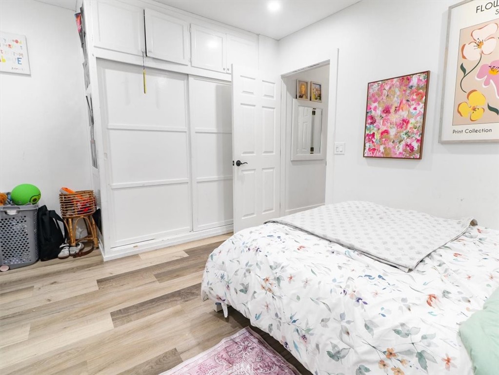 6502 Dos Rios Road Downey, CA 90240 - Photo 19 of 21 a bedroom with a bed and a painting on the wall